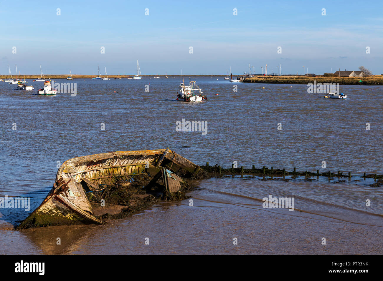An Abandoned and Derelict Old Sailing Boat at Orford in Suffolk Stock Photo