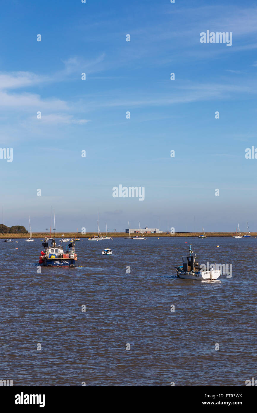 Boats Anchored and Moored on the River Ore Seperating Orford from Orford Ness on a Very Sunny October Afternoon Stock Photo