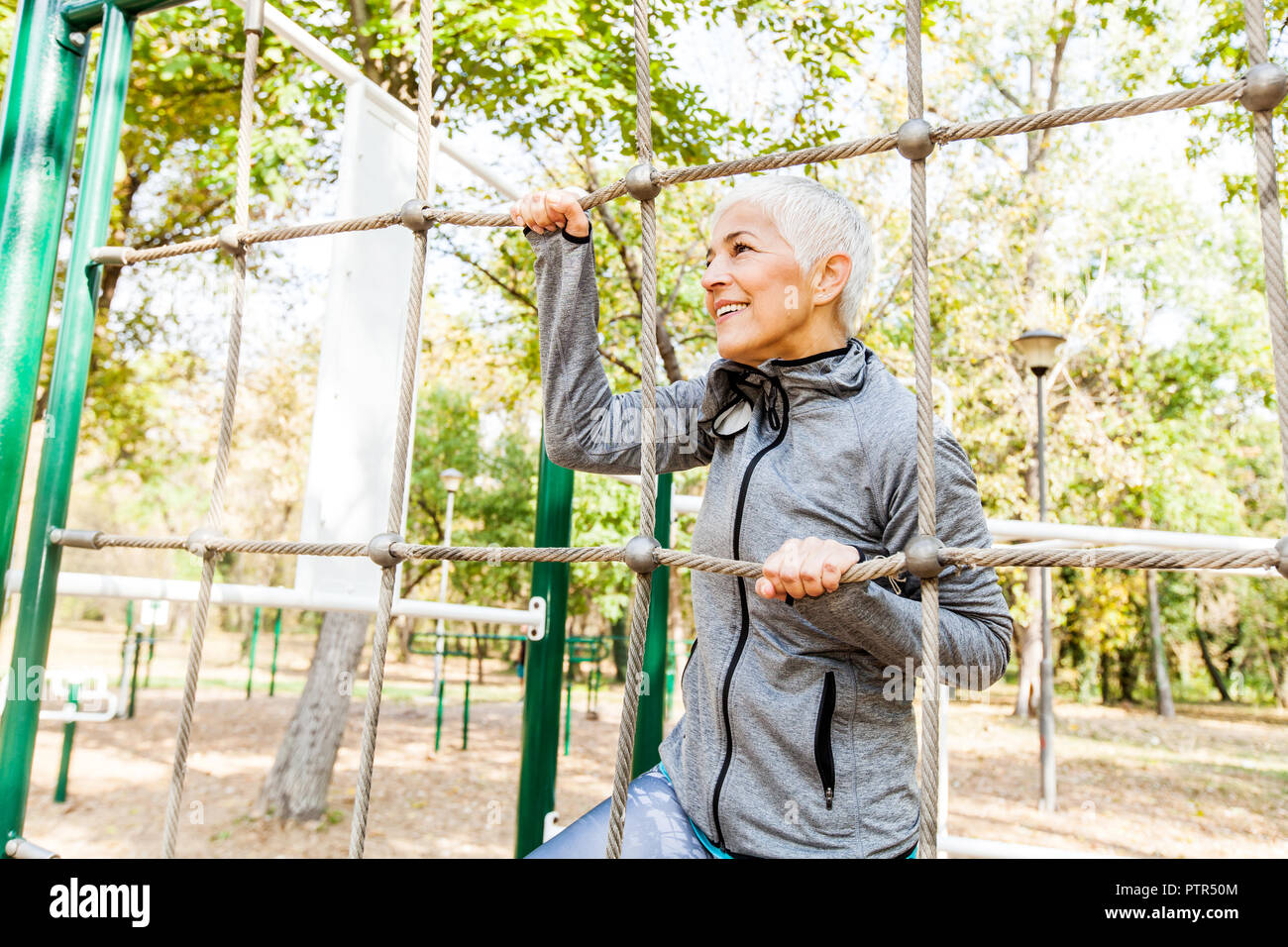 Fit Senior Woman Exercise At Outdoor Gym Sports Clothes Sporty