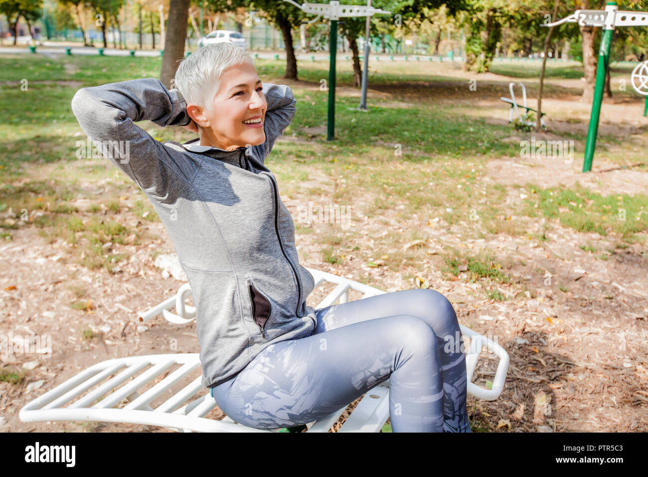 Active Senior Woman Exercise At Outdoor Gym, Healthy Lifestyle Stock Photo