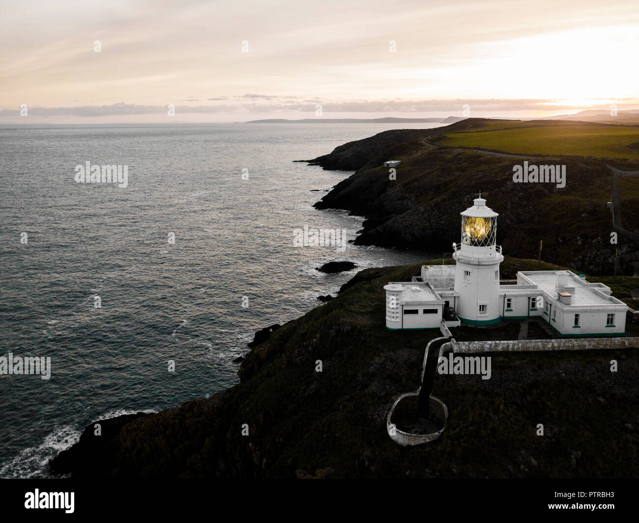Strumble Head Rocks Pembrokeshire, Wales, UK- Aerial view of Strumble Head lighthouse on ...