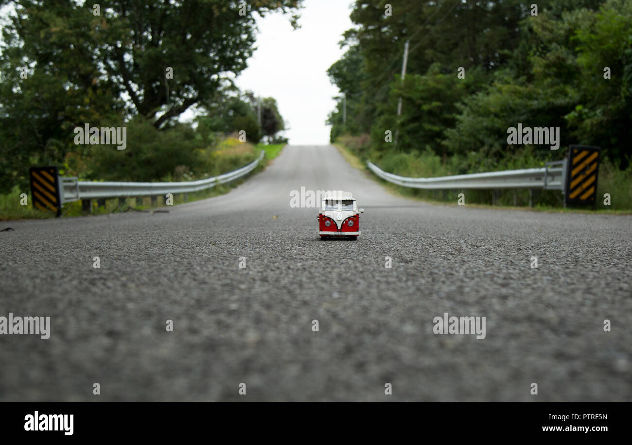 Lego volkswagon van driving down a country road. Stock Photo