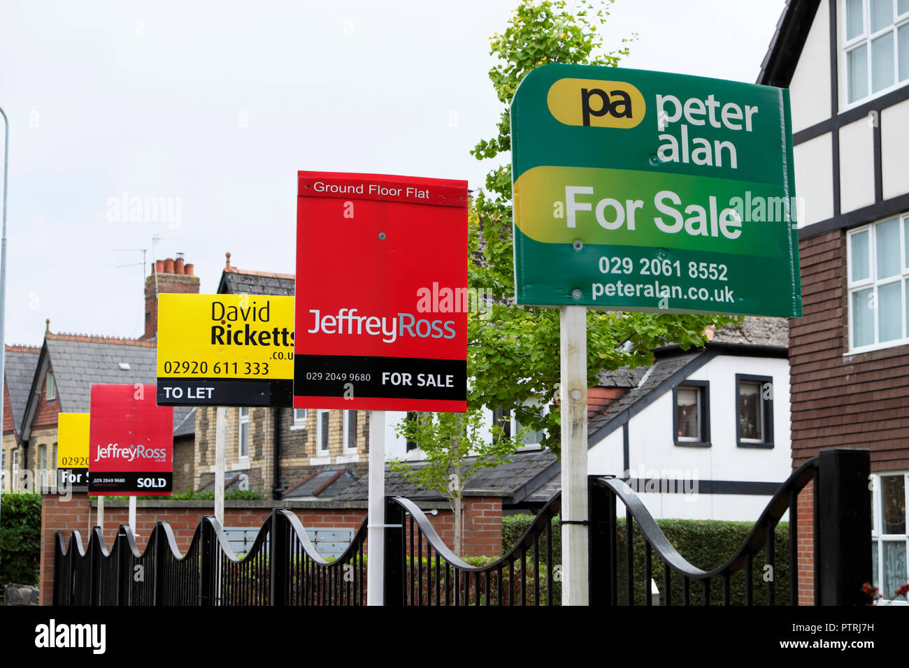 Various estate agents signs for sale outside apartment building in Cardiff Wales UK  KATHY DEWITT DE WITT Stock Photo