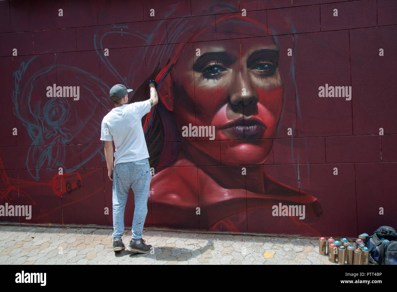 Johannesburg, South Africa, Oct. 10, 2018. 'Anser' works on his mural as the annual "City Of Gold" Urban Art Festival kicked off its graffiti street tour in Johannesburg today. Labelled vandalism by some, the festival highlights the positive aspects of this art form and seeks to increase the appreciation for it among the general public. These mural projects often enhance and activate sites in the Johannesburg inner-city area that are either forgotten or feared by the city's inhabitants, organizers said. Credit: Eva-Lotta Jansson/Alamy Live News Stock Photo