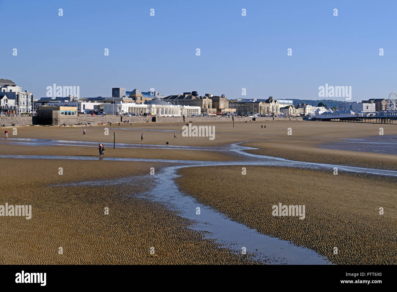 Weston-super-Mare, UK. 10th October, 2018. UK weather: walkers on the beach enjoy the sunshine as the temperature reaches 70º F. Keith Ramsey/Alamy Live News Stock Photo