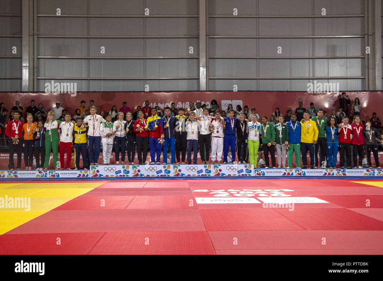 Buenos Aires, Buenos Aires, Argentina. 10th Oct, 2018. The fourth and final day of judo in Buenos Aires 2018 had mixed team competition, where boys and girls from different countries and continents competed as teams.The Beijing team consisting of Artsiom Kolasau (Belarus), Li Ling Liu (China Taipei), Jaykhunbek Nazarov (Uzbekistan), Carlos PÃ¡ez (Venezuela), Itzel Pecha (Mexico), Ana Viktorija Puljiz (Croatia) and VerÃ³nica Toniolo (Italy) were the members of the team that climbed to the top of the podium and received the gold medals on the tatami.Team competitions are promoted in the yo Stock Photo