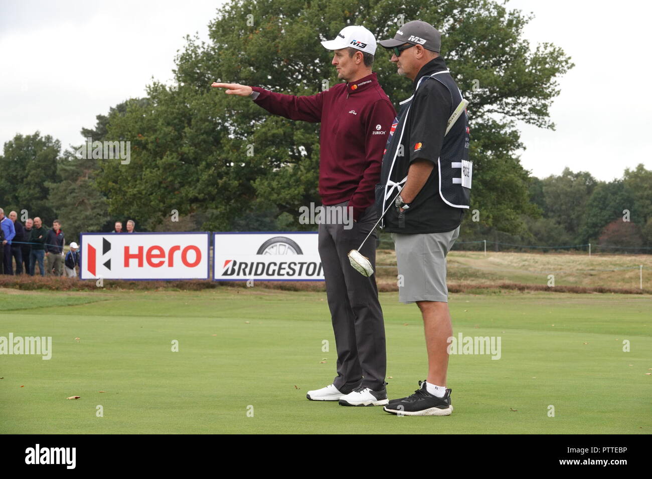 Walton Heath Golf Club, UK. 11th October, 2018. Justin Rose with his caddie  on 13th at