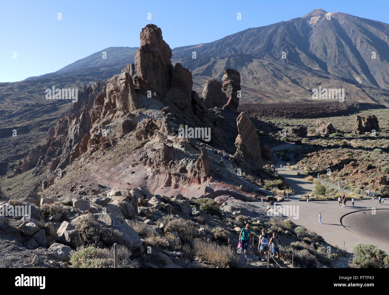 At the viewpoint Mirador Roques de Garcia on the way to the Pico del Teide on the Canary Island Tenerife on 18.09.2018. The rock formation Roques de Garcia is located about five kilometers south of the summit of Teide at an altitude of about 2200 m at the edge of the extensive Caldera Las Ca-adas. The area is part of the Teide National Park (Parque Nacional del Teide). The Pico del Teide (also Teyde) is with 3718 m the highest elevation on the Canary Island of Tenerife and the highest mountain in Spain. It belongs to the municipality of La Orotava. In 2007, the territory of the National Park w Stock Photo