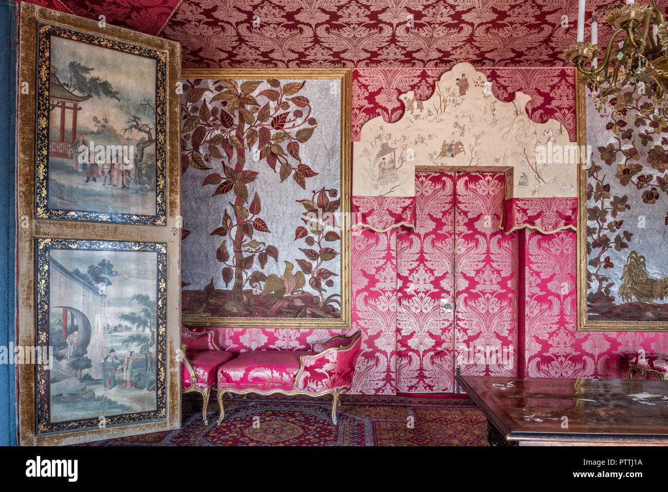 18th century Chinese lacquer panels with red damask wall coverings in Hauteville House Stock Photo