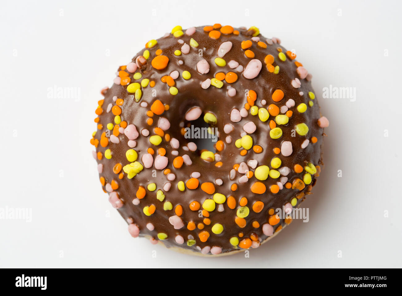 Simple Glazed chocolate Donut on light background. Top view Stock Photo