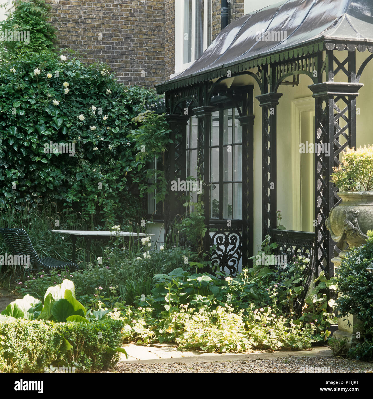 Victorian porch and garden of Kensington home Stock Photo