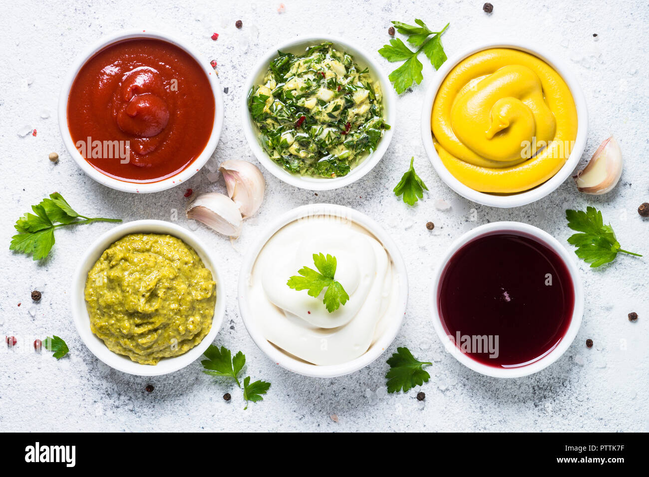 Set of sauces ketchup, mayonnaise, mustard soy sauce, bbq sauce, pesto, chimichurri, mustard