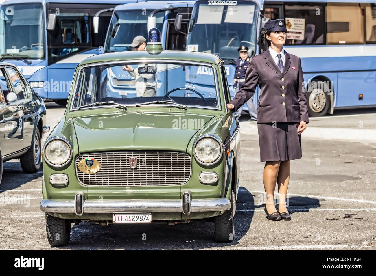 Ostia Lido, Roma. Italy 09/30/2018. Vintage Police Woman posing with old Police car, Fiat 1100 at the  50 anniversary Italian Police Association Stock Photo