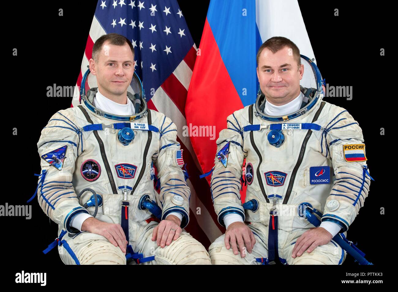 Expedition 57 crew member cosmonaut Alexey Ovchinin of Roscosmos, right, and Nick Hague of NASA portraits in their Sokol launch and entry suits at the Gagarin Cosmonaut Training Center November 16, 2017 in Star City, Russia. International Space Station Expedition 57 crew Nick Hague of NASA and Alexey Ovchinin of Roscosmos are scheduled to launch on October 11th and will spend the next six months living and working aboard the International Space Station. Stock Photo