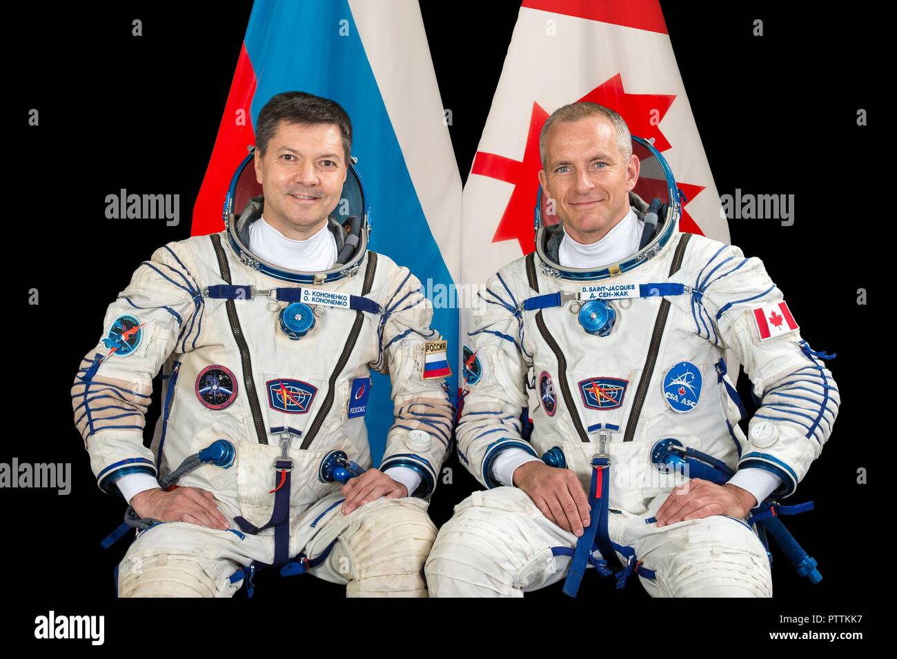 Expedition 57 backup crew members Oleg Kononenko of Roscosmos, left, and David Saint-Jacques of the Canadian Space Agency portrait in their Sokol launch and entry suits at the Gagarin Cosmonaut Training Center November 16, 2017 in Star City, Russia. International Space Station Expedition 57 crew Nick Hague of NASA and Alexey Ovchinin of Roscosmos are scheduled to launch on October 11th and will spend the next six months living and working aboard the International Space Station. Stock Photo