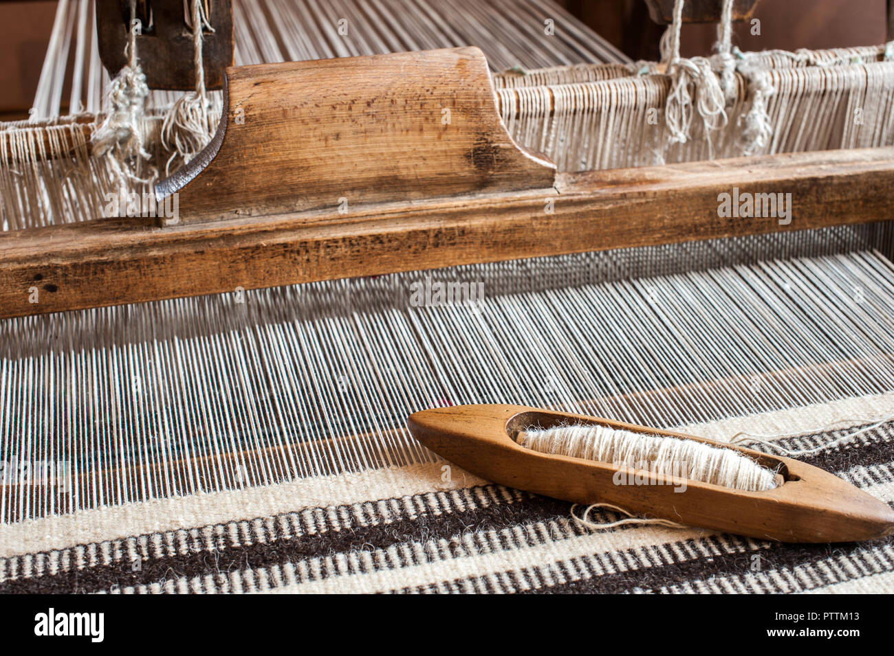 Weaving loom and shuttle on the warp. Weaving background and sample Stock Photo Alamy