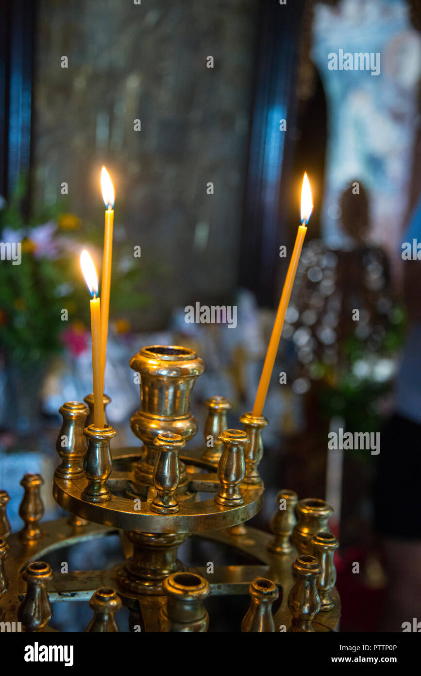 3 lighted candle inside a church Stock Photo Alamy