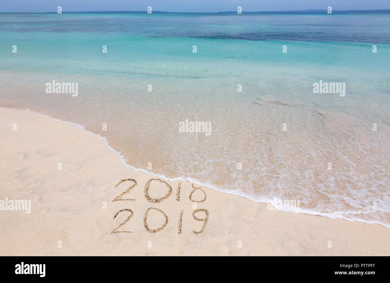 Year 2018 is washed away by ocean wave Stock Photo
