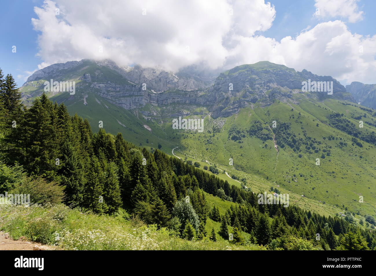 View towards La Tournette from a footpath trail in the forests around Col de la Forclaz France Stock Photo