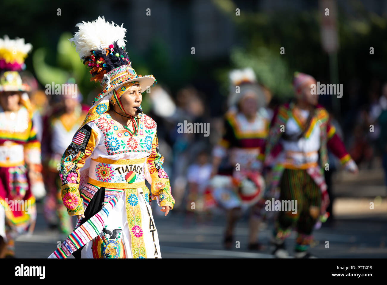 Washington, D.C., USA - September 29, 2018: The Fiesta DC Parade, bolivian woman wearing traditional clothing walking down the street Stock Photo