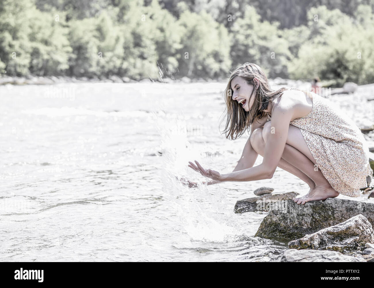 Junge Frau Spritzt Mit Wasser Model Released Stock Photo
