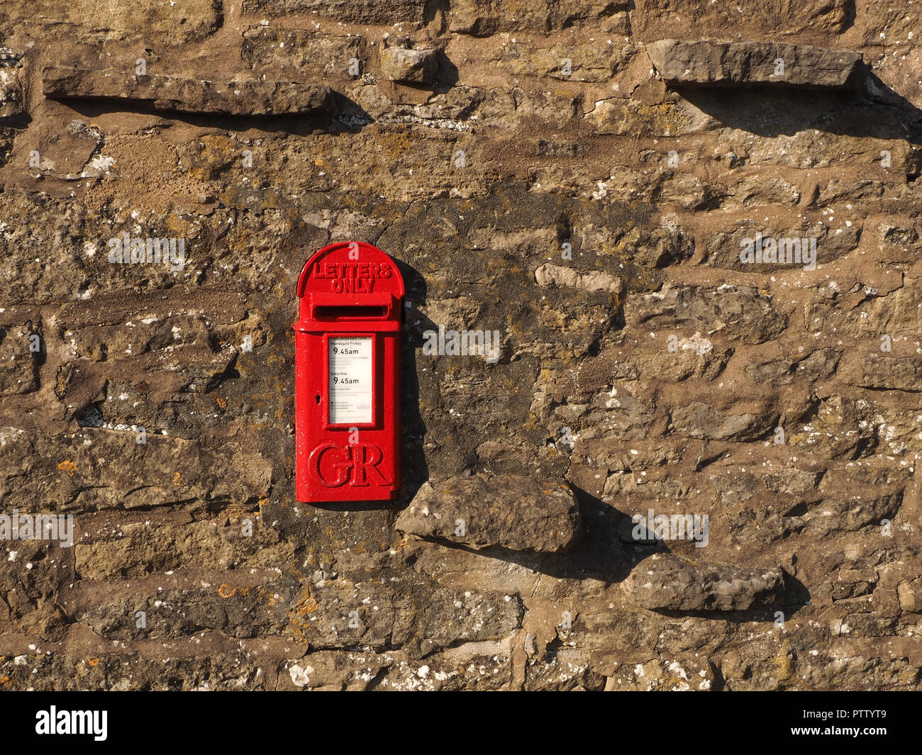old fashioned 1920s asymmetric small red GR letterbox with no regnal