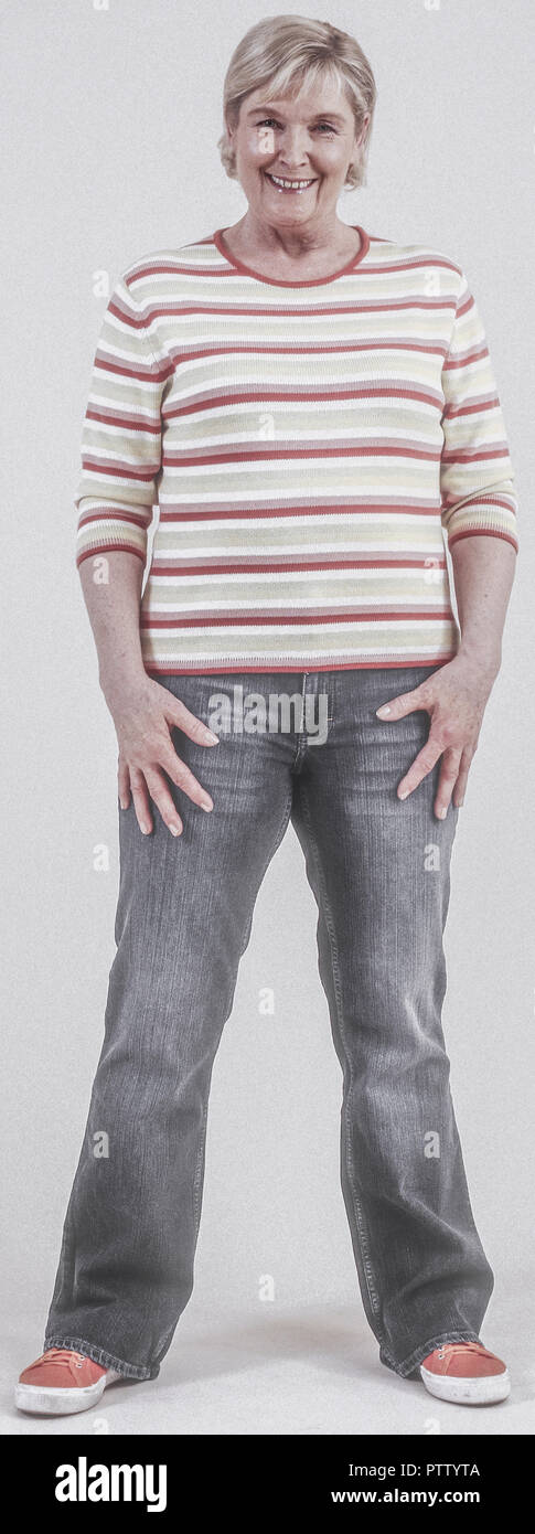 Seniorin in Jeans und Pulli (model-released) Stock Photo