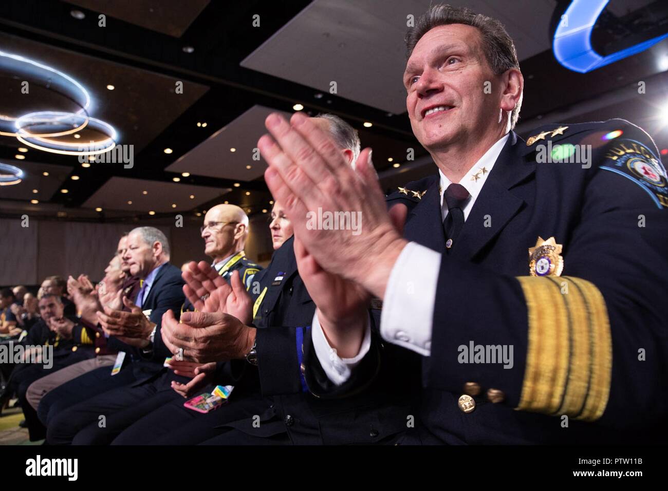 Police Chiefs applaud U.S President Donald Trump during his addresses the International Association of Chiefs of Police and Law Enforcement Convention at the Orange County Convention Center October 8, 2018 in Orlando, Florida. Stock Photo