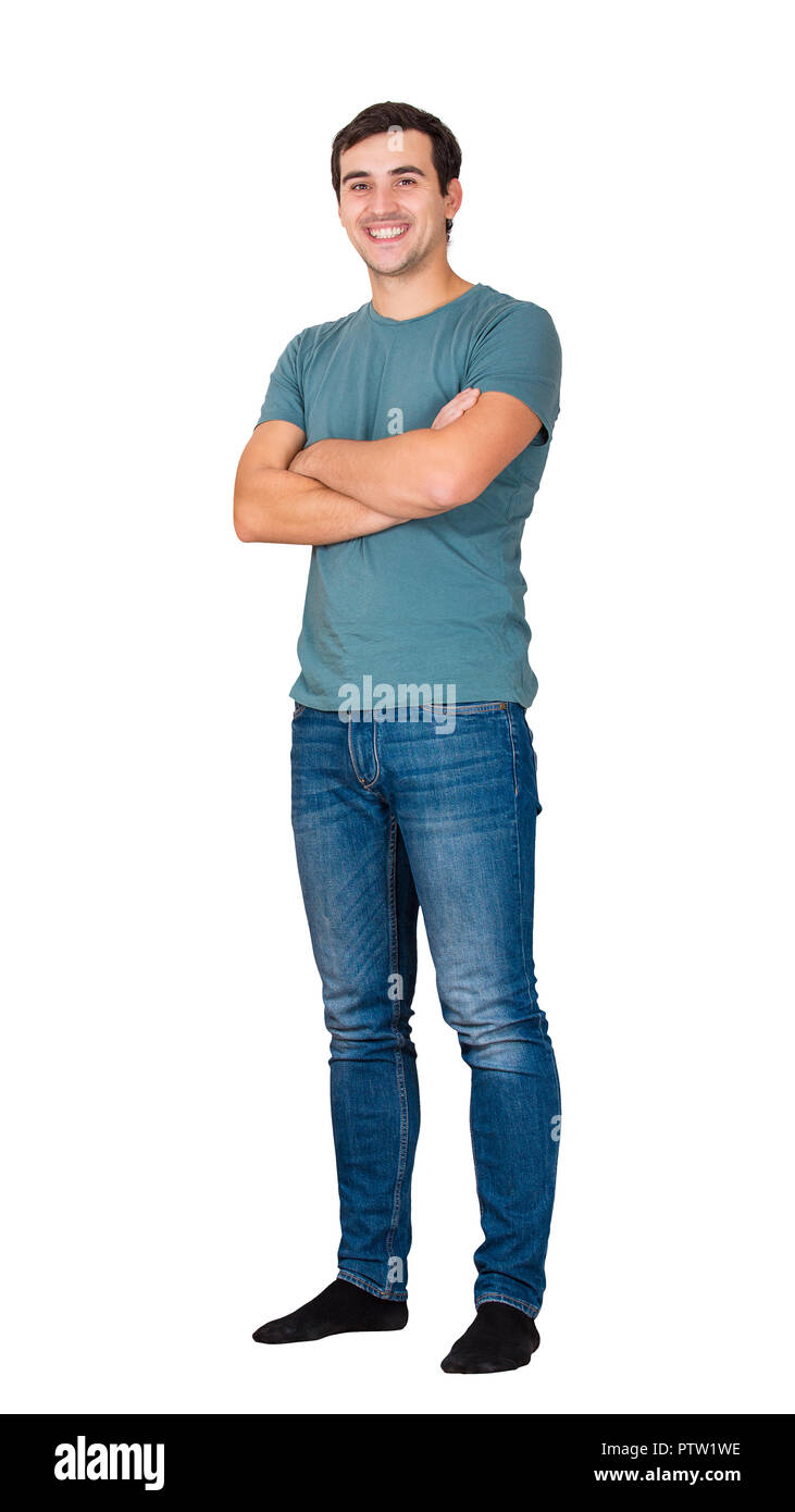 Excited confident young man smiling, hands crossed looking to camera. Full portrait casual boy isolated over white background. Stock Photo