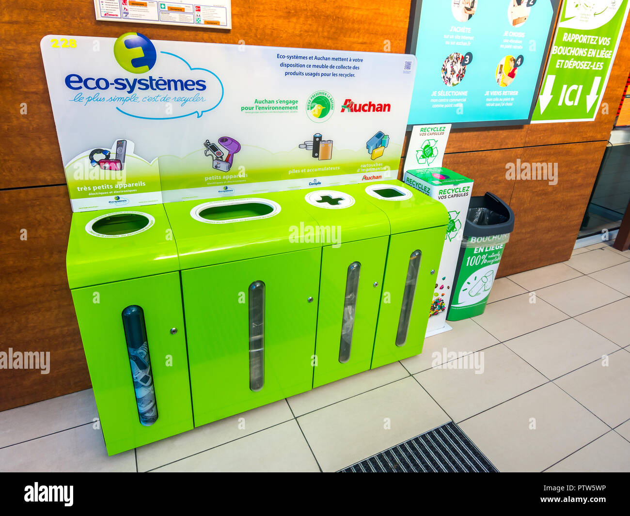 Recycling dispensers for batteries and surplus electrical goods - France. Stock Photo