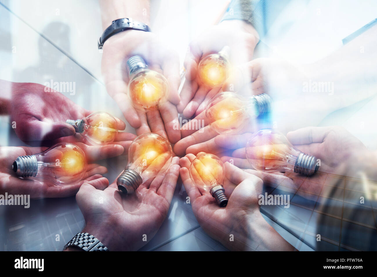 Teamwork and brainstorming concept with businessmen that share an idea with a lamp. Concept company startup. Double exposure Stock Photo