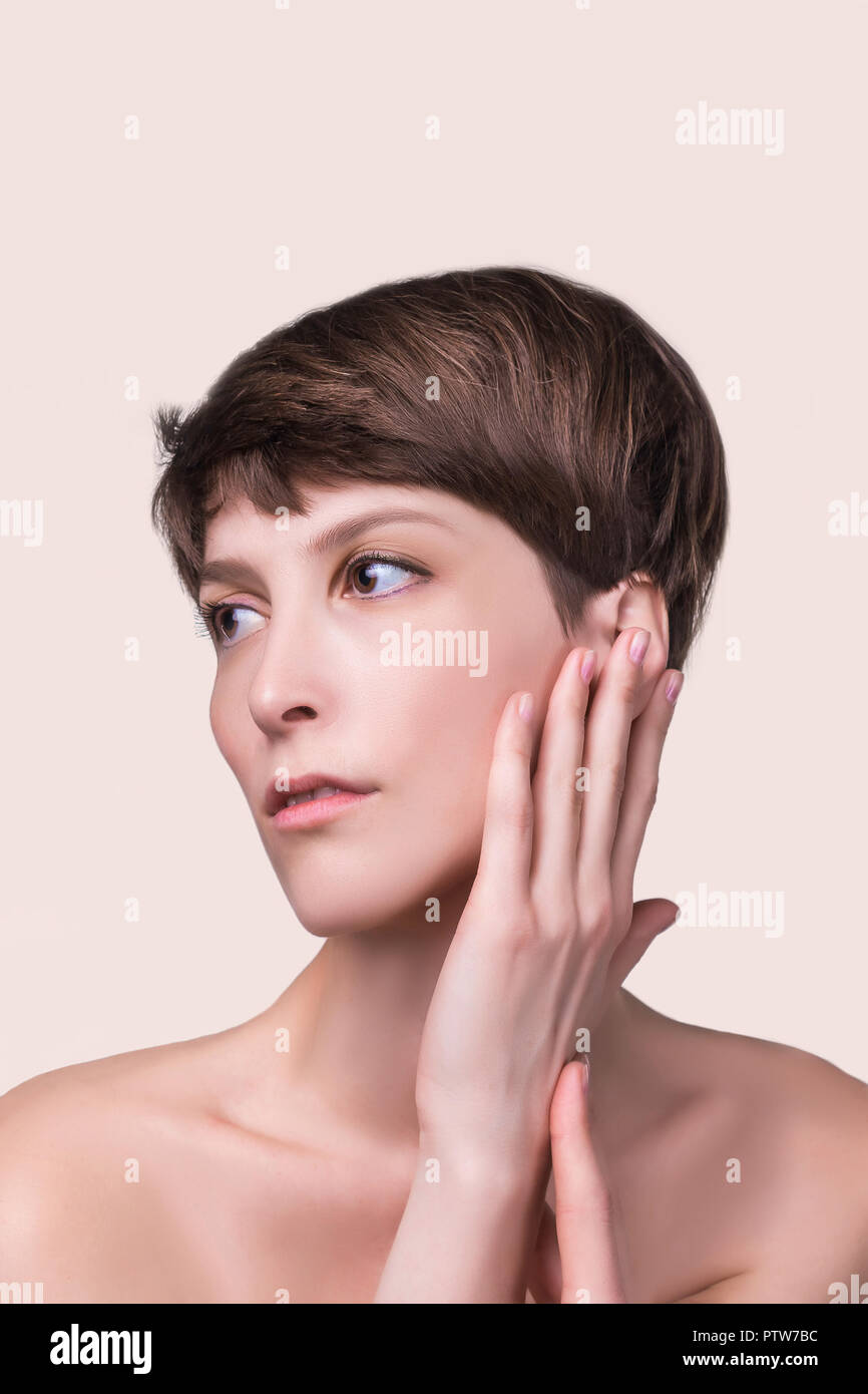 Beautiful female face close up. portrait of young model at studio on ...