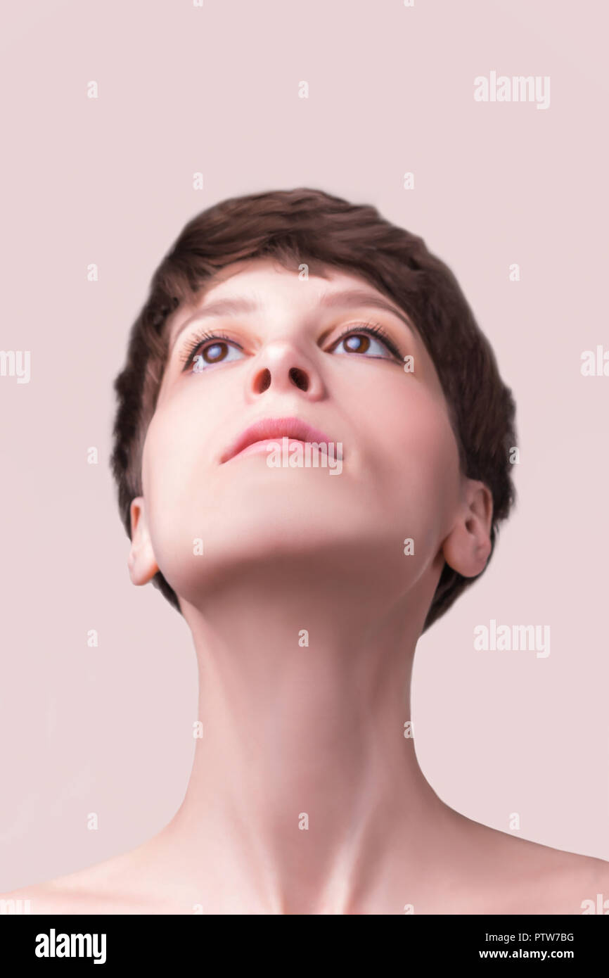 Beautiful female face close up. portrait of young model at studio on ...