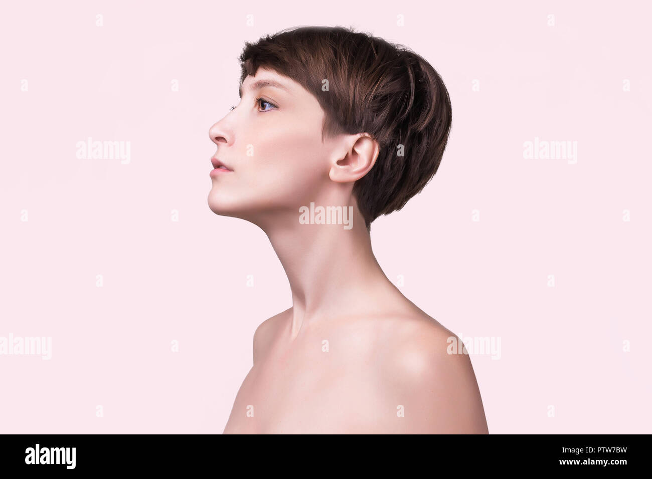 Beautiful female face close up. portrait of young model at studio on ...