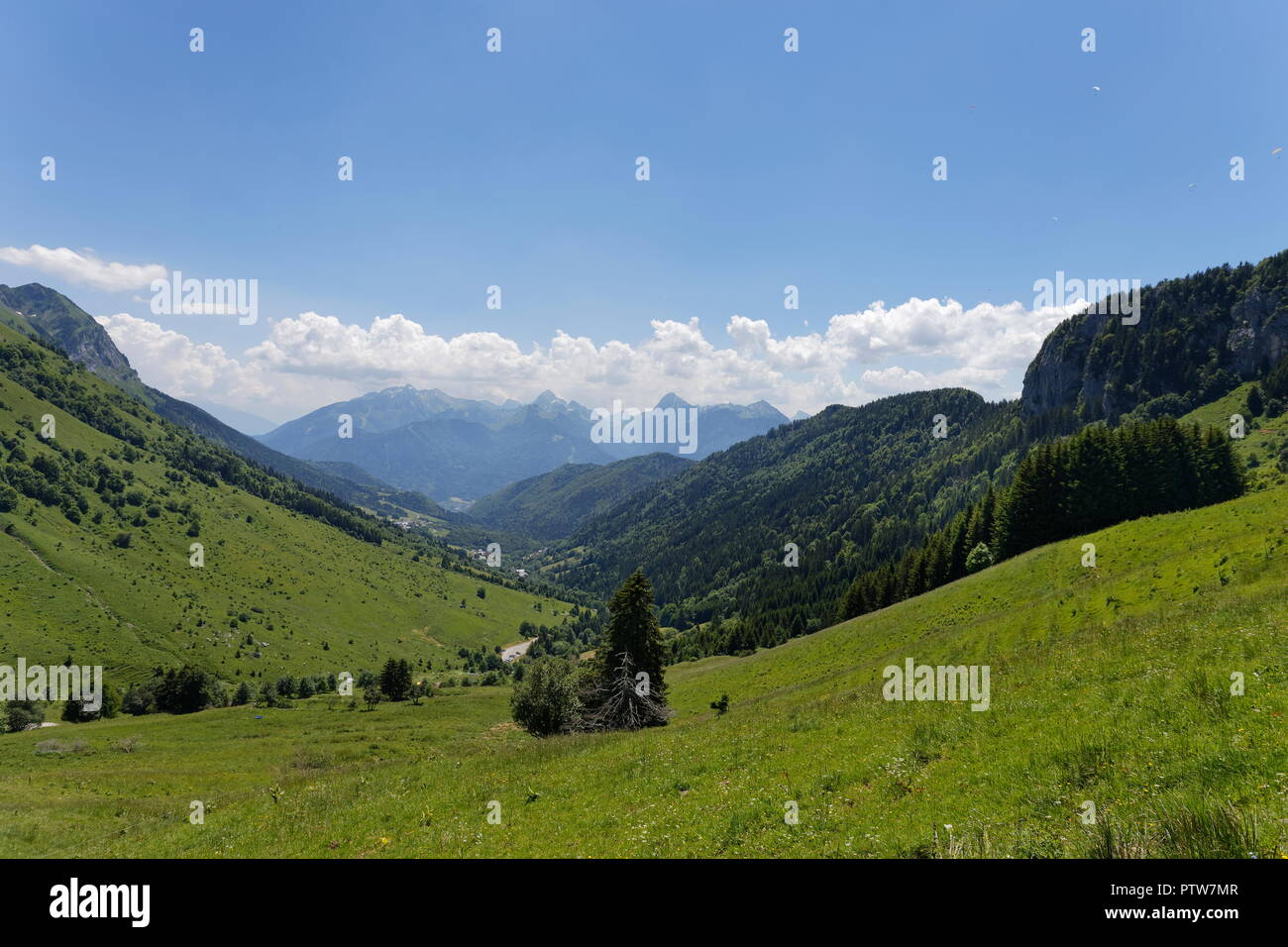 View down a valley towards Montmin above Lake Annecy France Stock Photo