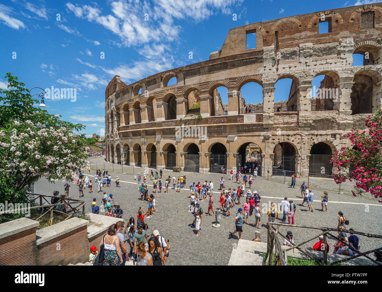 the monumental facade of the Colosseum, the largest Roman amphitheatre ever built and one of Rome's most iconic tourist attractions Stock Photo