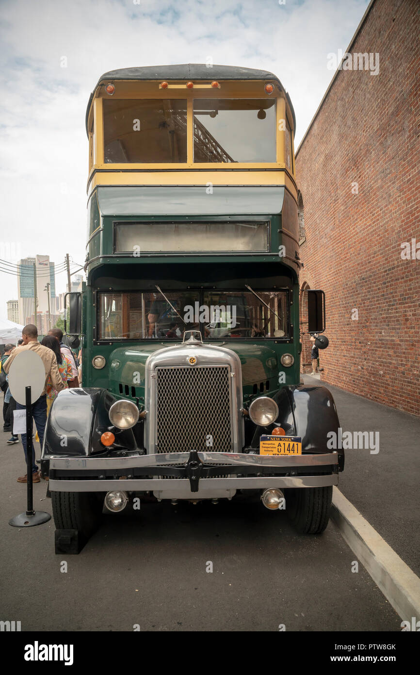 Double-decker bus at the 25th Annual New York City Transit Museum Bus Festival in Brooklyn Bridge Park in Brooklyn in New York on Sunday, October 7, 2018. Once a year the museum rolls out its fleet of vintage buses dating from the early 20th century to the most current vehicles allowing people to reminisce and wallow in nostalgia for the vehicles, which become a sort of time machine taking visitors back to another era. (Â© Richard B. Levine) Stock Photo