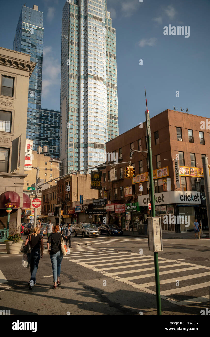 Residential development rises above Downtown Brooklyn in New York on Sunday, October 7, 2018. The area has been for years a middle and lower economic shopping strip but because of increased development in the area, notably hi-rise luxury apartment buildings, chain stores and high-end retailers are moving in. Rents are rising and the smaller mom and pop stores, as well as regional chains are being forced out.  (Â© Richard B. Levine) Stock Photo