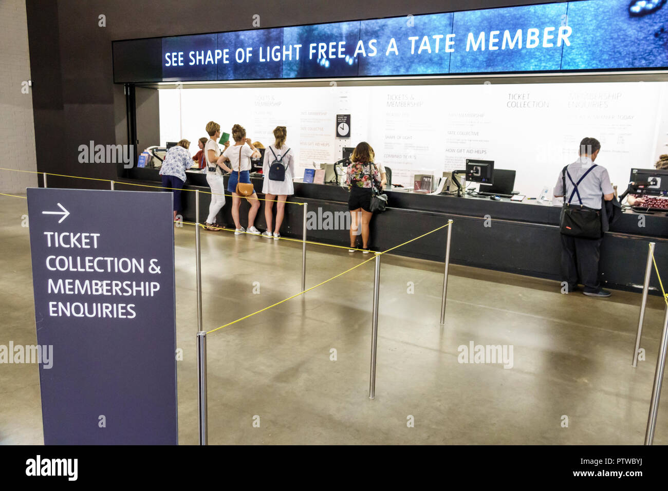 London England,UK,Southwark,Bankside,TateModern,contemporary art museum  gallery,interior inside,ticket membership front desk,man men male,woman  female Stock Photo - Alamy