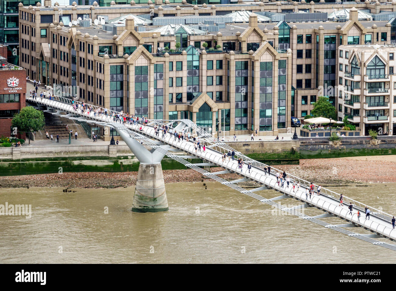 London England,UK,Bankside,River Thames,Tate Modern art museum terrace view,Millennium Bridge,suspension footbridge,pedestrians crossing bridge,UK GB Stock Photo