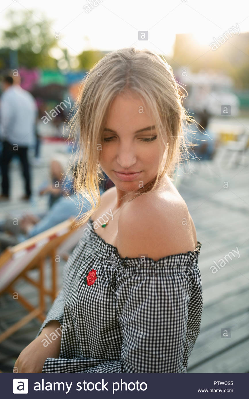 Young woman looking over shoulder Stock Photo