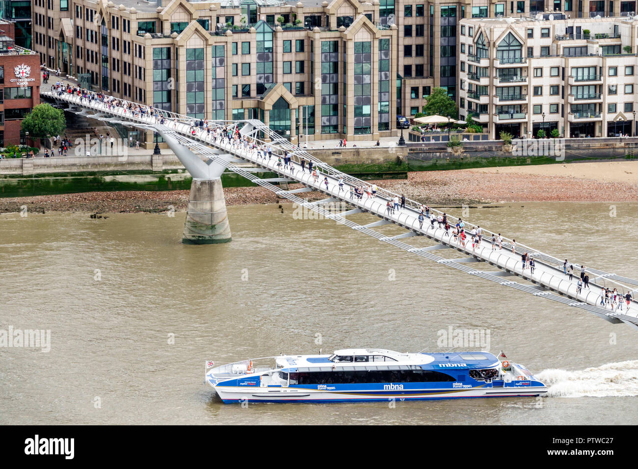 London England,UK,Bankside,River Thames,Tate Modern art museum terrace view,Millennium Bridge,suspension footbridge,pedestrians crossing bridge,sights Stock Photo