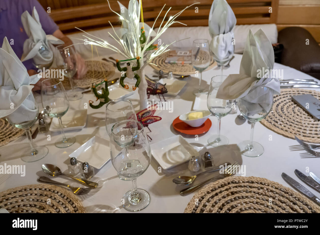 Peru, South America.  Table decorations with handmade sloths and butterflies on a tour boat. Stock Photo