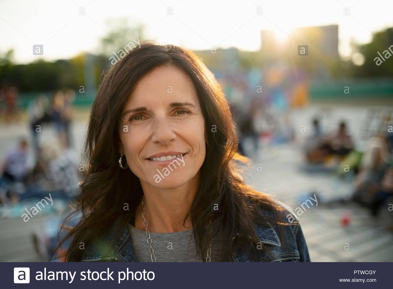 Confident mature woman standing hi-res stock photography and images - Alamy