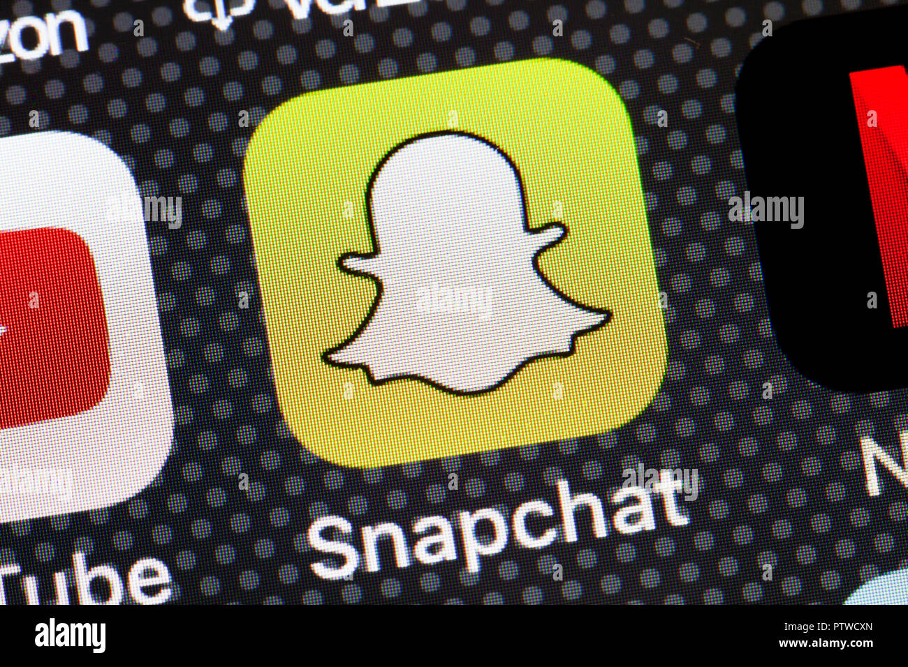 Snapchat app icon on iPhone (close up, macro) - USA Stock Photo