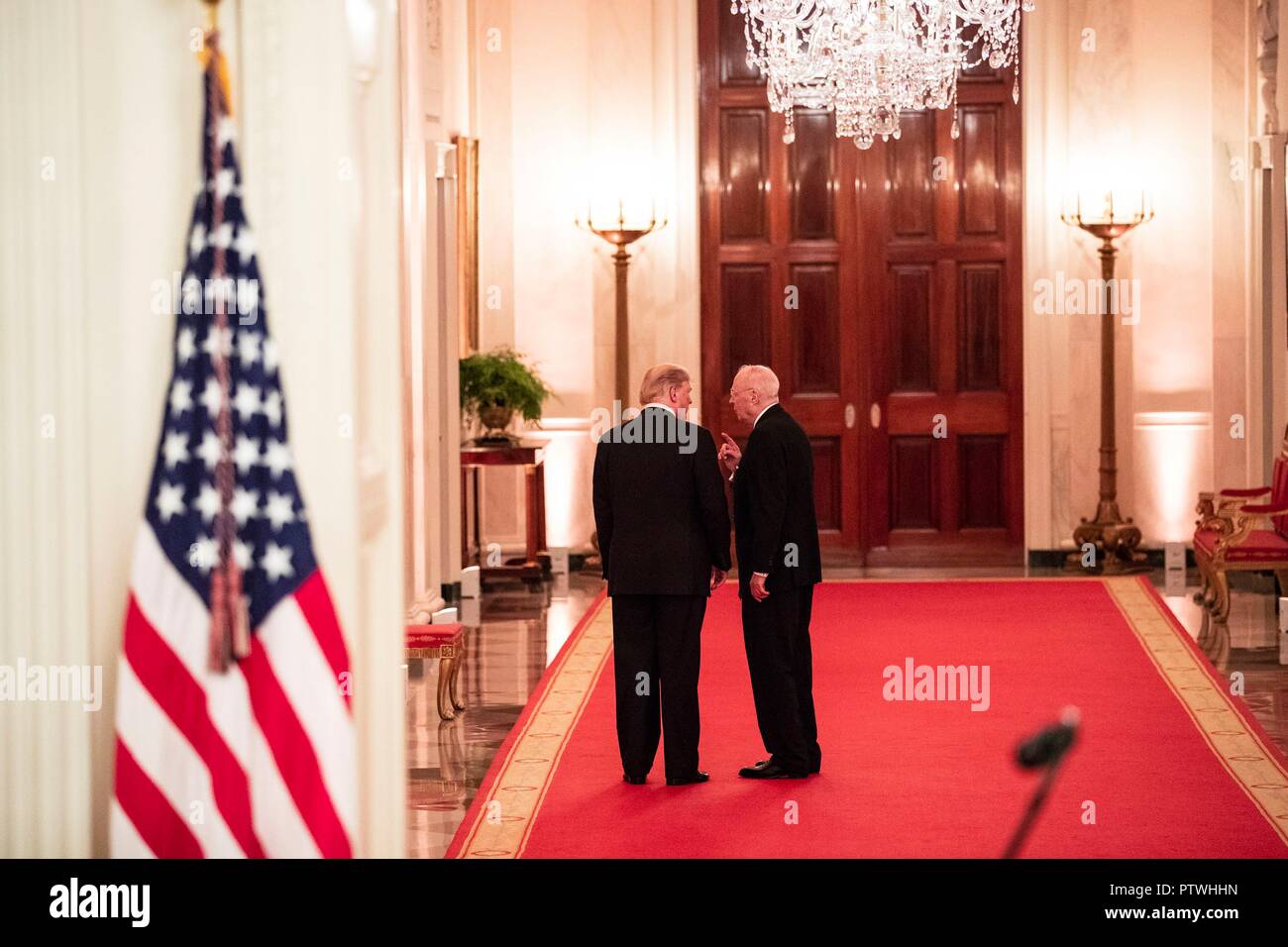 U.S President Donald Trump speaks with Anthony Kennedy, right, retired Associate Justice of the Supreme Court, following the swearing-in of Judge Brett Kavanaugh to be the Supreme Court 114th justice at the White House October 8, 2018 Washington, DC. Stock Photo