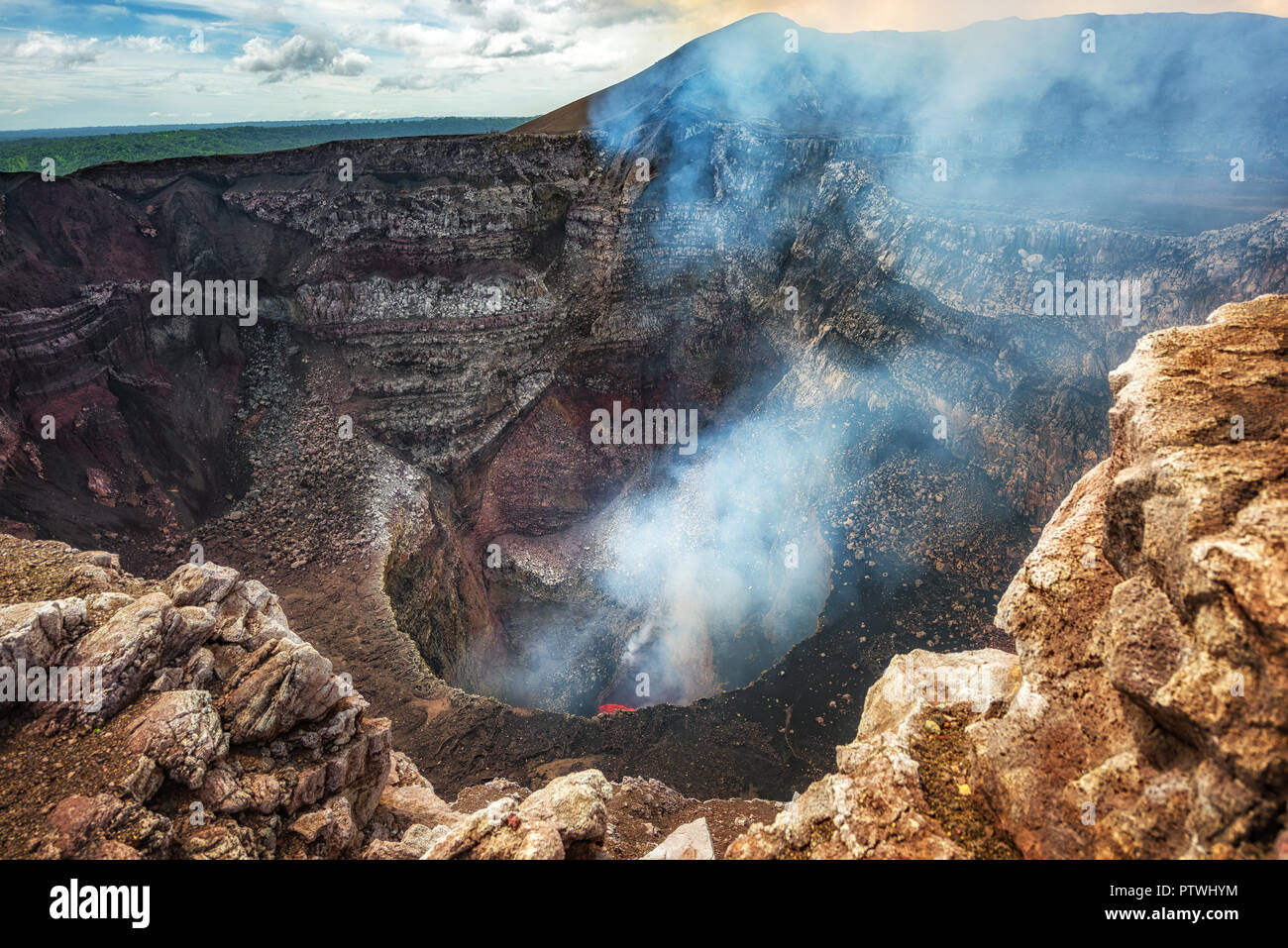 Masaya Volcano National Park in Nicaragua, wide shot of the active volcano with boiling lava in the bottom Stock Photo