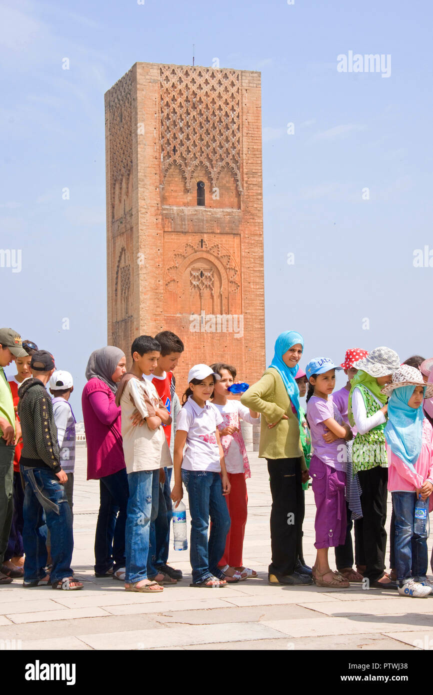 Students lined up to visit Tour Hassan, an unfinished Mosque with ...