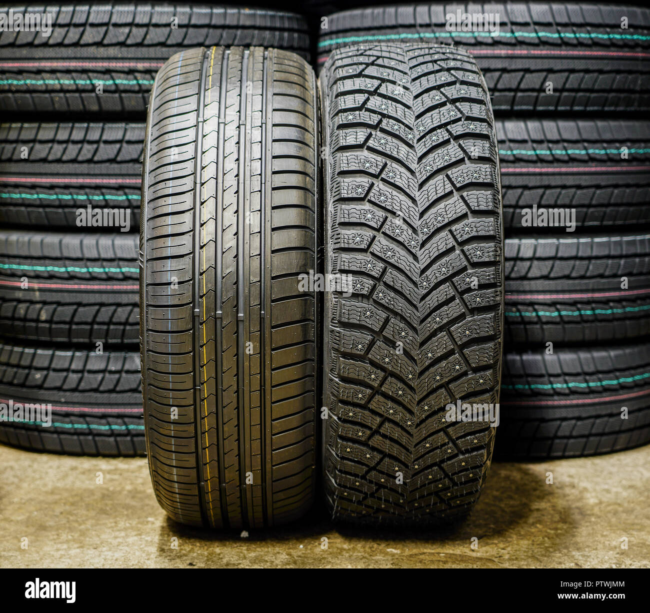beside new winter tire with studs and summer tire Stock Photo