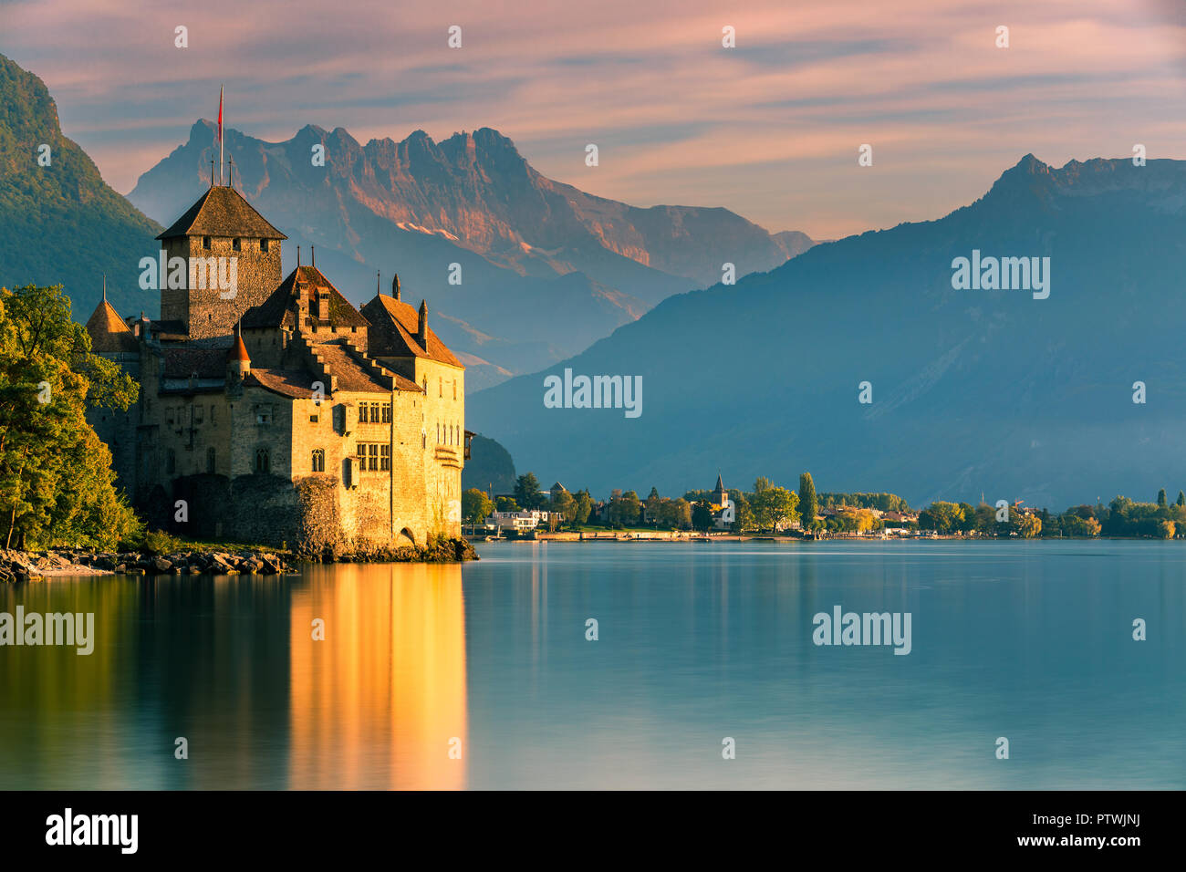 Chillon Castle (French: Château de Chillon) is an island castle located on Lake Geneva (Lac Léman), south of Veytaux in the canton of Vaud. Stock Photo